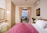 First floor bedroom, queen size bed, direct access to the pool